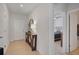 Inviting entryway featuring tiled floor, wood console table with vases, with a bedroom view at 178 Aria Way, Davenport, FL 33837