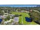 Aerial view of the community with ponds, golf course and water view at 21 Abbey Ct, Haines City, FL 33844