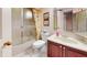 Clean bathroom with glass shower, modern fixtures, and ample storage space at 21 Abbey Ct, Haines City, FL 33844