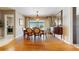 Elegant dining room with wood flooring, a view of the backyard, and traditional decor at 21 Abbey Ct, Haines City, FL 33844