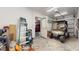 Spacious garage with a golf cart and door to a possible second bay at 21 Abbey Ct, Haines City, FL 33844