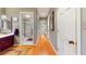 Hallway with wood floors that connect to the bathroom and other areas of the home at 21 Abbey Ct, Haines City, FL 33844