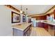 Bright kitchen featuring a large island, stainless steel refrigerator, tile floors, and attractive decor at 21 Abbey Ct, Haines City, FL 33844