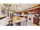 Spacious kitchen with large island, pendant lighting, stainless steel appliances, and ample cabinet space at 21 Abbey Ct, Haines City, FL 33844