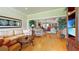 Spacious living room with open floor plan, wood floors, and a seamless flow to other areas at 21 Abbey Ct, Haines City, FL 33844