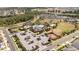 Aerial view of the community with a pool, clubhouse, playground and basketball court at 2126 Ridge Pointe Ln, Clermont, FL 34715