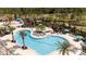 Aerial view of a community pool featuring multiple lounging areas and a splash pad at 2126 Ridge Pointe Ln, Clermont, FL 34715