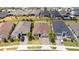 Aerial view of the home showing the neighborhood, green lawns and nearby roadways at 2126 Ridge Pointe Ln, Clermont, FL 34715