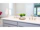 Bathroom with double vanity, quartz countertops, and elegant decor at 2126 Ridge Pointe Ln, Clermont, FL 34715