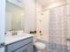 Bathroom featuring a shower-tub combination and stylish gray vanity at 2126 Ridge Pointe Ln, Clermont, FL 34715