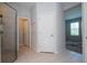 Bathroom showcasing glass shower, white tile, and access to the bedroom at 2126 Ridge Pointe Ln, Clermont, FL 34715