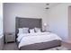 Serene bedroom featuring gray bed, mirrored nightstand, and plush carpet at 2126 Ridge Pointe Ln, Clermont, FL 34715