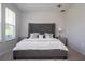 Comfortable bedroom with a luxurious gray bed, side tables, and soft carpet at 2126 Ridge Pointe Ln, Clermont, FL 34715