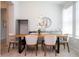Open dining area featuring a light wood table with seating for six, in a bright and airy space at 2126 Ridge Pointe Ln, Clermont, FL 34715