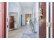 Bright entryway with wood floors, high ceilings and a view through the living spaces at 2126 Ridge Pointe Ln, Clermont, FL 34715