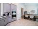 Well-equipped kitchen with built-in stainless steel oven, gray cabinetry, and eat in dining space at 2126 Ridge Pointe Ln, Clermont, FL 34715