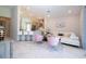 Open living space with barstool seating at kitchen counter and modern decor at 2126 Ridge Pointe Ln, Clermont, FL 34715