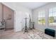 Bright office space with built-in cabinets, natural light, and stylish area rug at 2126 Ridge Pointe Ln, Clermont, FL 34715