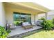 Covered patio with a sliding glass doors perfect for outdoor seating and entertaining at 2126 Ridge Pointe Ln, Clermont, FL 34715