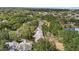 An aerial view shows the neighborhood's lush greenery, well-maintained homes and serene environment at 220 Wimbledon Cir, Lake Mary, FL 32746