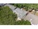 An aerial view of the home showcasing the roof, surrounding trees, and private setting at 220 Wimbledon Cir, Lake Mary, FL 32746