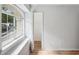 A bedroom featuring an arched window, a closet, and neutral decor at 220 Wimbledon Cir, Lake Mary, FL 32746