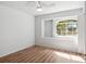 Bedroom featuring wood floors, an arched window, and natural light at 220 Wimbledon Cir, Lake Mary, FL 32746