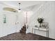 Inviting foyer with wood flooring, a staircase, and a decorative console table at 220 Wimbledon Cir, Lake Mary, FL 32746