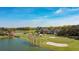 Beautiful golf course and lake view of the community amenities, including clubhouse and golf course at 220 Wimbledon Cir, Lake Mary, FL 32746