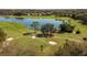 The golf course features manicured greens, sand traps and mature trees at 220 Wimbledon Cir, Lake Mary, FL 32746