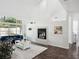 Bright living room featuring a fireplace, plush seating and ample natural light at 220 Wimbledon Cir, Lake Mary, FL 32746