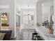 Open concept living space with bar seating, stainless steel appliances, and ample natural light at 220 Wimbledon Cir, Lake Mary, FL 32746
