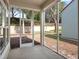 Screened-in patio with view of the backyard and mature trees at 220 Wimbledon Cir, Lake Mary, FL 32746