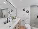 Modern bathroom with double sinks, sleek fixtures, and stylish gray tile accents at 2205 Pine Island Dr, New Smyrna Beach, FL 32168