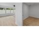Bright bedroom with large windows, ceiling fan, and light wood-look flooring at 2205 Pine Island Dr, New Smyrna Beach, FL 32168