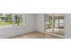 Bright room featuring a large window and sliding glass door at 2205 Pine Island Dr, New Smyrna Beach, FL 32168