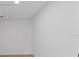 Bright white room with light wood-look floors and a ceiling access panel at 2205 Pine Island Dr, New Smyrna Beach, FL 32168