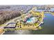 Aerial view of community amenities, including a large pool, clubhouse, and lakefront recreation areas at 2417 Annacella Ave, Kissimmee, FL 34741