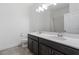 Bathroom featuring double vanity, quartz counters, and modern fixtures at 2417 Annacella Ave, Kissimmee, FL 34741