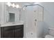 Modern bathroom featuring a glass shower, quartz counters, and a sink at 2417 Annacella Ave, Kissimmee, FL 34741