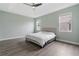 This main bedroom features two windows and light green paint at 2417 Annacella Ave, Kissimmee, FL 34741