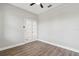 This bedroom offers hardwood floors, neutral walls, and a ceiling fan, creating a blank slate for design at 2417 Annacella Ave, Kissimmee, FL 34741