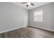 Bright bedroom features modern ceiling fan, hardwood floors and a window at 2417 Annacella Ave, Kissimmee, FL 34741