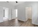 Bedroom featuring hardwood floors, access to bathroom, closet, and patio at 2417 Annacella Ave, Kissimmee, FL 34741