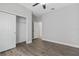 Bedroom features modern ceiling fan, hardwood floors and a closet at 2417 Annacella Ave, Kissimmee, FL 34741