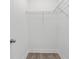 Open closet with wire shelving and hardwood floors at 2417 Annacella Ave, Kissimmee, FL 34741