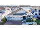 Charming single-Gathering home with a brick driveway, a three-car garage, and a well-maintained front yard at 2417 Annacella Ave, Kissimmee, FL 34741