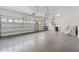 Spacious two car garage featuring finished walls, epoxy flooring, high ceilings and natural light at 2417 Annacella Ave, Kissimmee, FL 34741