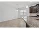 This kitchen nook features an island with granite countertop and a large window at 2417 Annacella Ave, Kissimmee, FL 34741