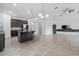This kitchen boasts an island and stainless steel appliances and flows into the living area at 2417 Annacella Ave, Kissimmee, FL 34741